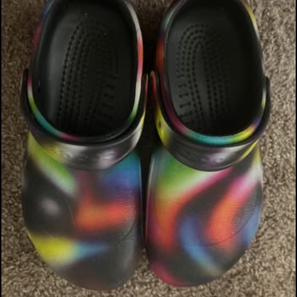 Multi colored crocs women’s size 9 and 7 in men’s
